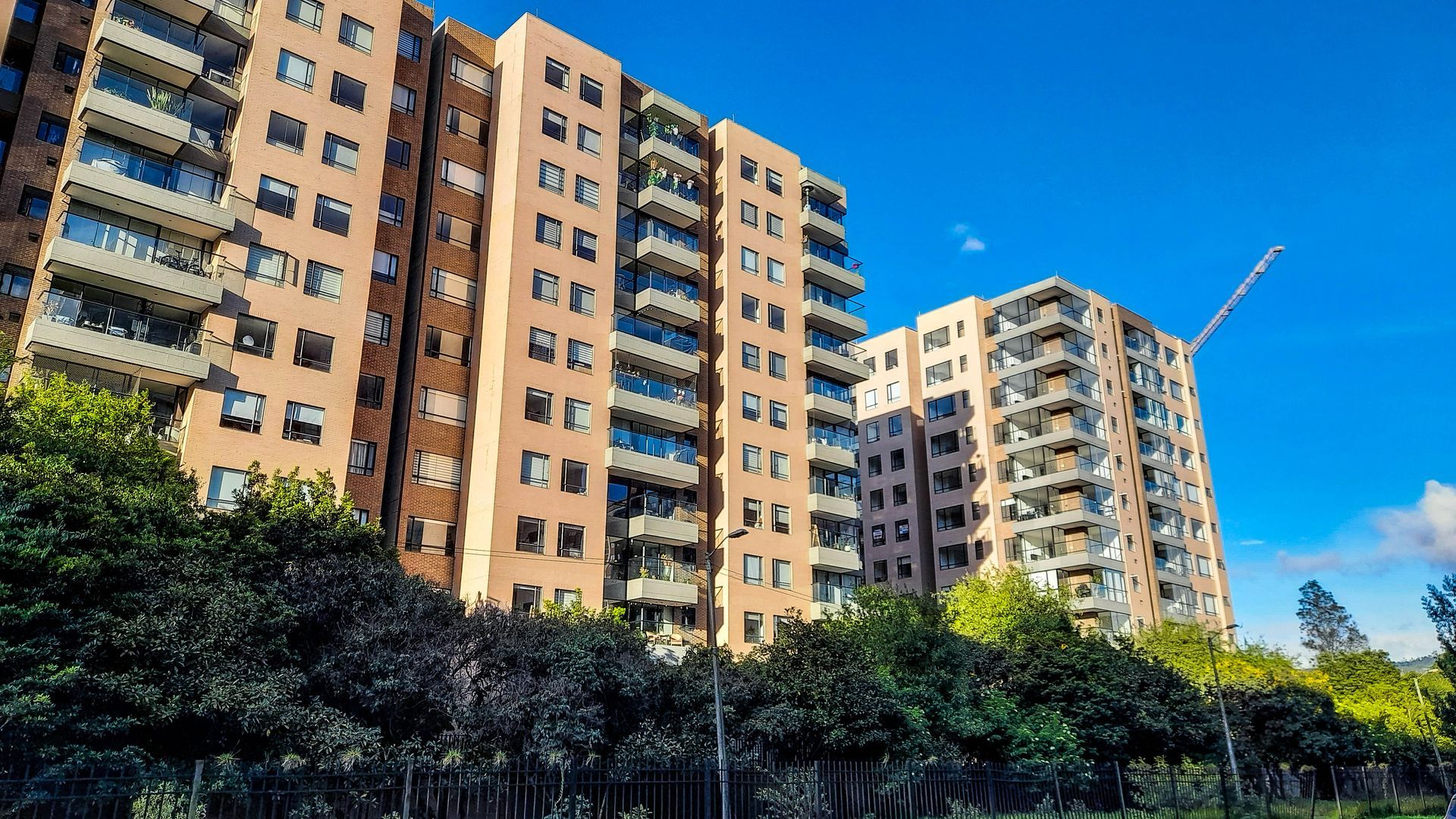 Modern Residential Buildings Framed by a Clear Blue Sky Modern Residential Buildings Framed by a Clear Blue Sky