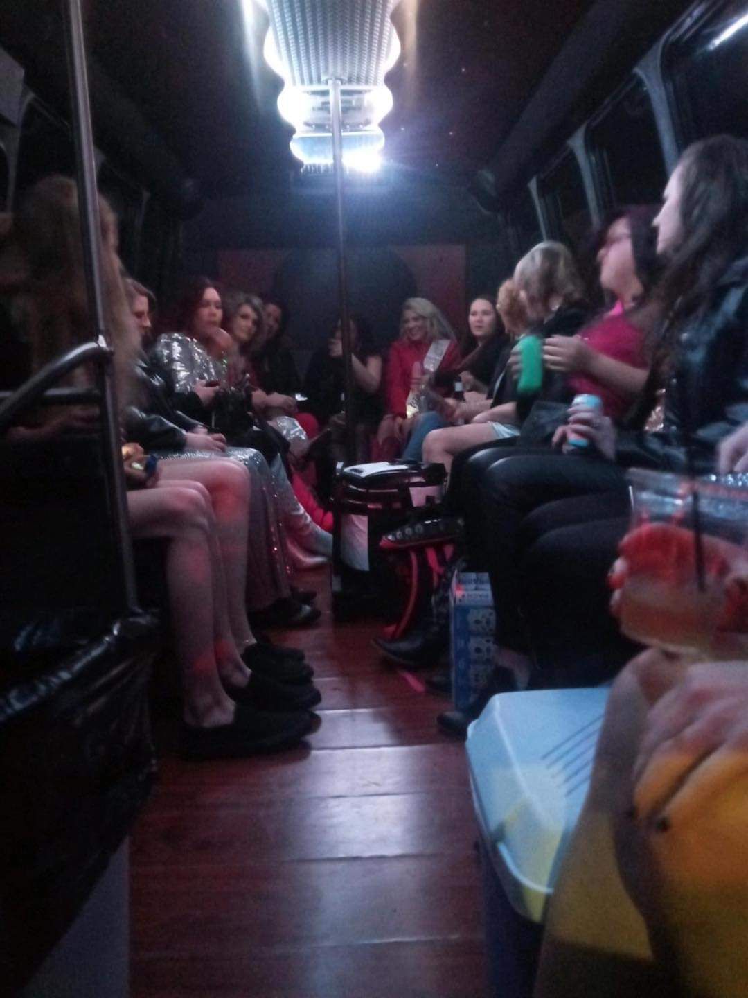 A group of people are sitting on a bus