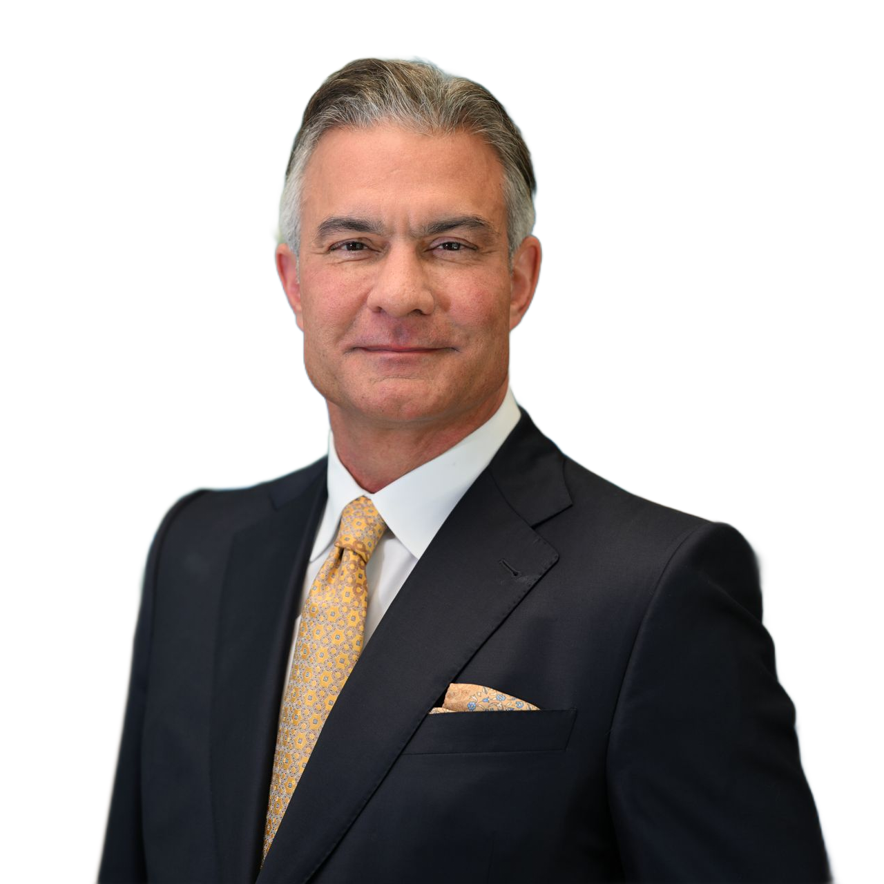 Man in navy suit, gold tie, and pocket square, smiling.