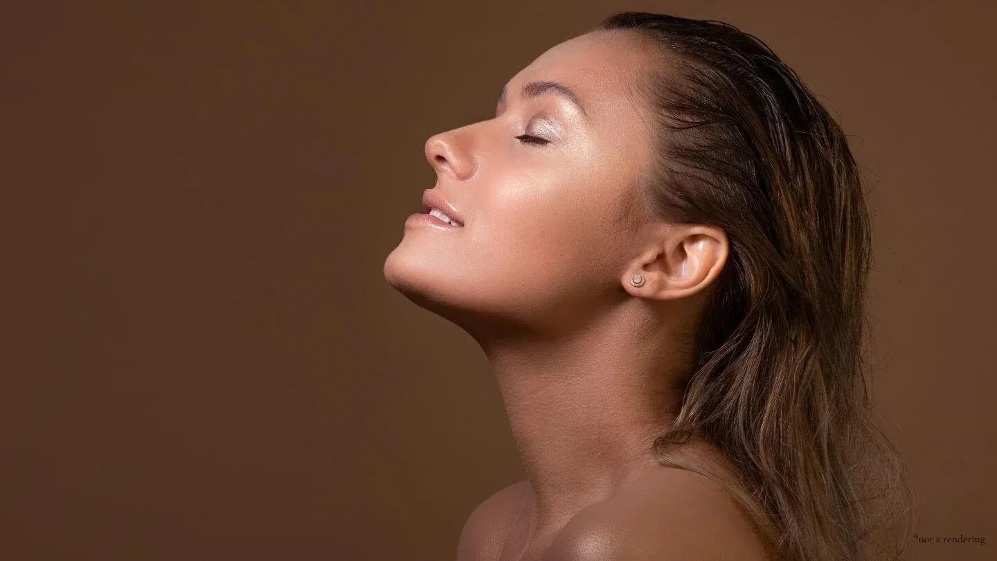 Woman with closed eyes, head tilted back, against a brown background, wet hair, and glowing skin.