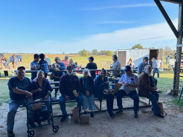 A group of people are standing on a stage in a church.