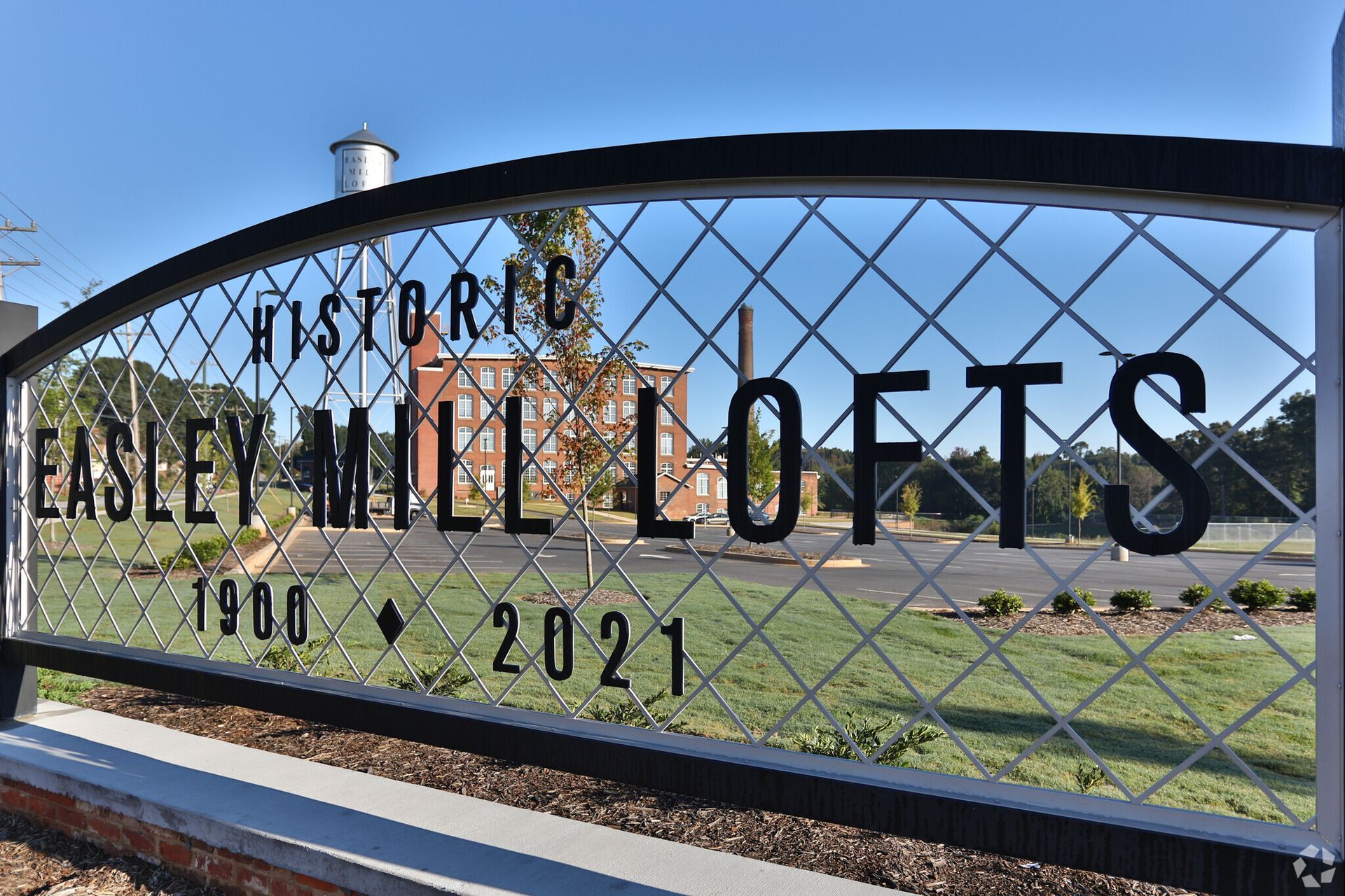A sign that says easley mill lofts on it.