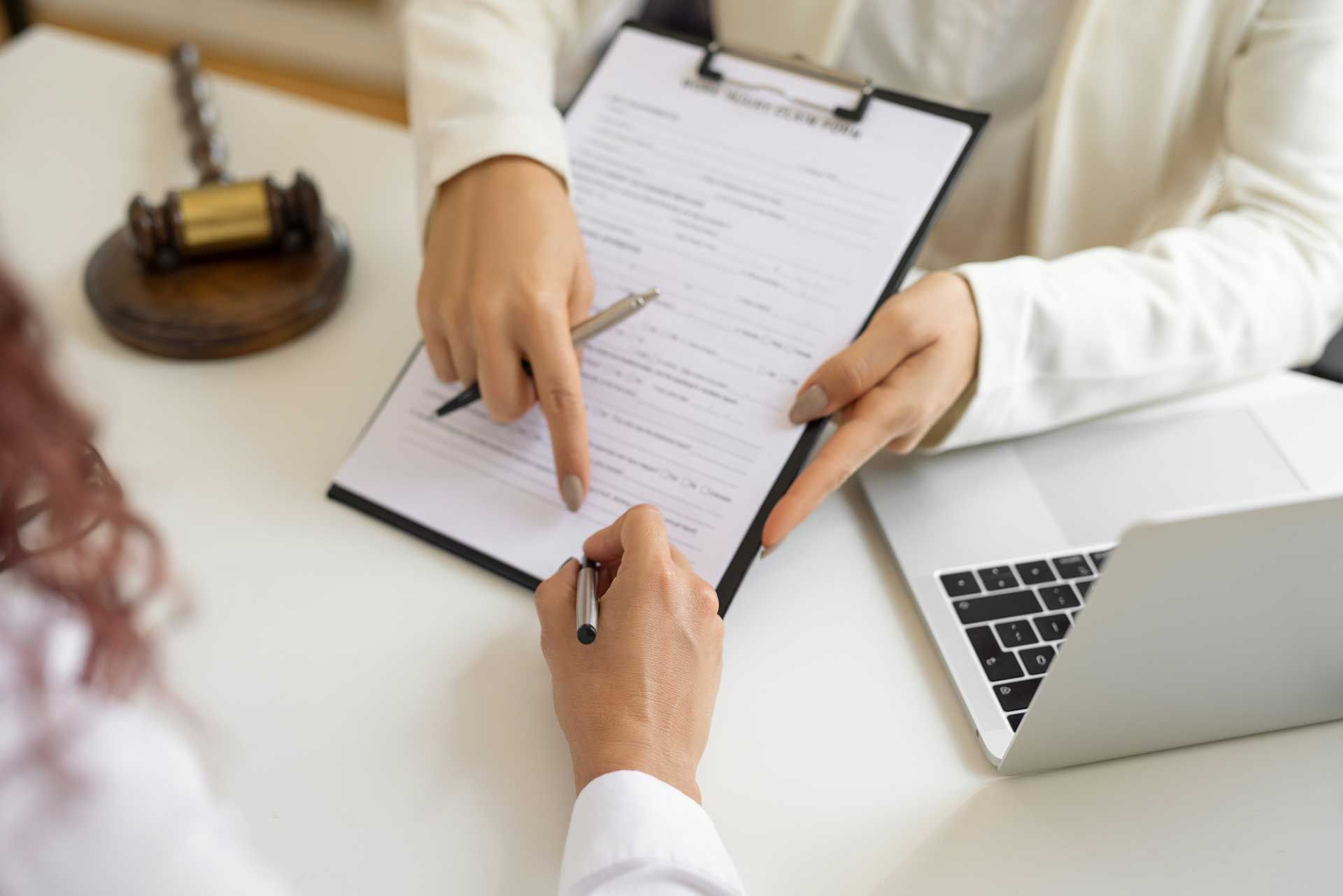 A lawyer explains a contract about regulation and discusses it with the consultant in the law firm