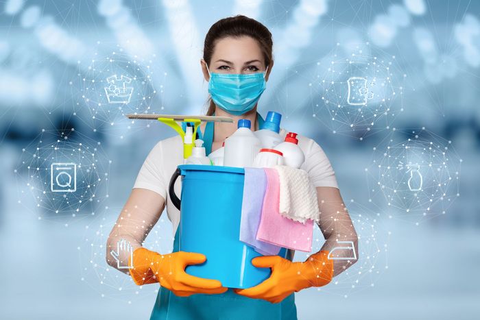 A cleaner holding cleaning supplies