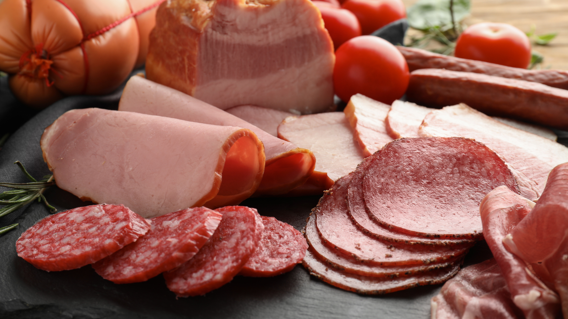 There are many different types of meat on the table.