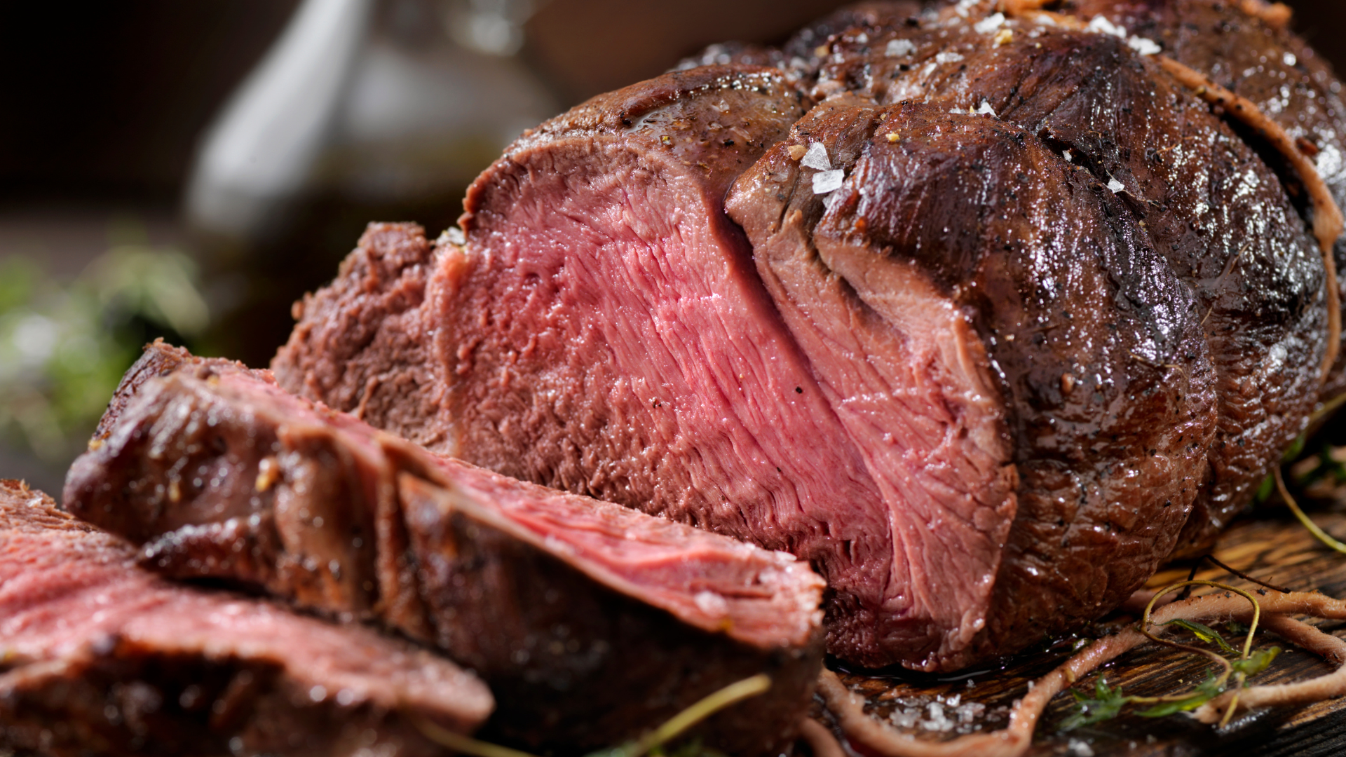 A close up of a piece of roast beef on a table.