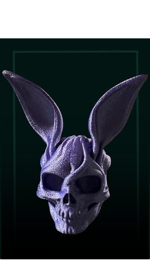 Purple skull with large rabbit-like ears on a black background