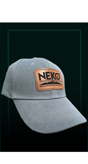 A grey baseball cap with a brown rectangular leather patch featuring the black text 