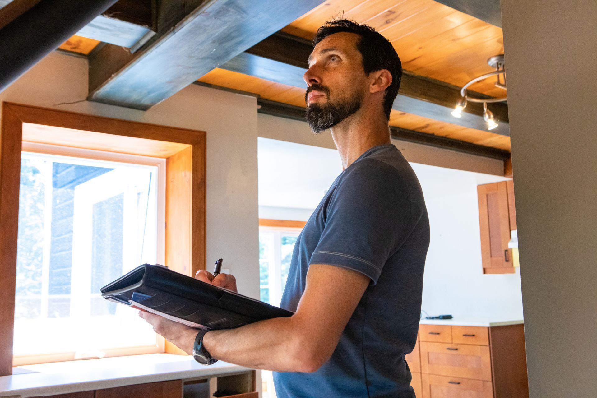 A man is inspecting a house. A man is inspecting a house.