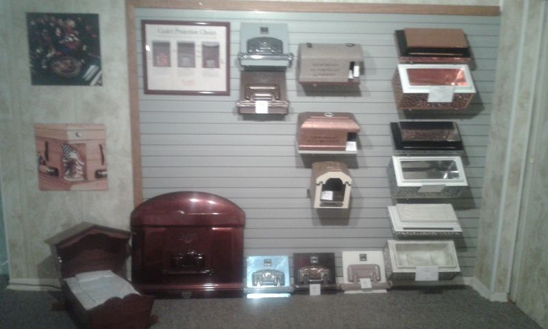 A room with a lot of coffins on the wall