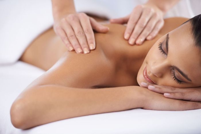 A woman is getting a massage at a spa.