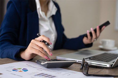 Bookkeeper Working On Sales Report