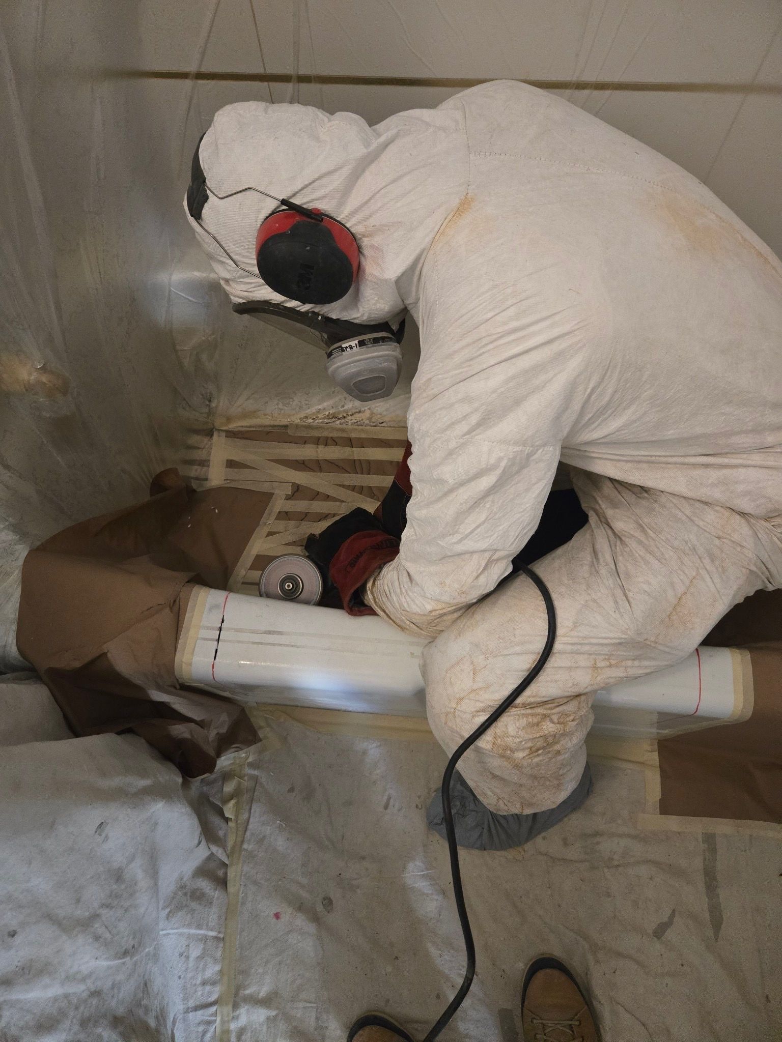 A close up of a shower door with a handle on it.