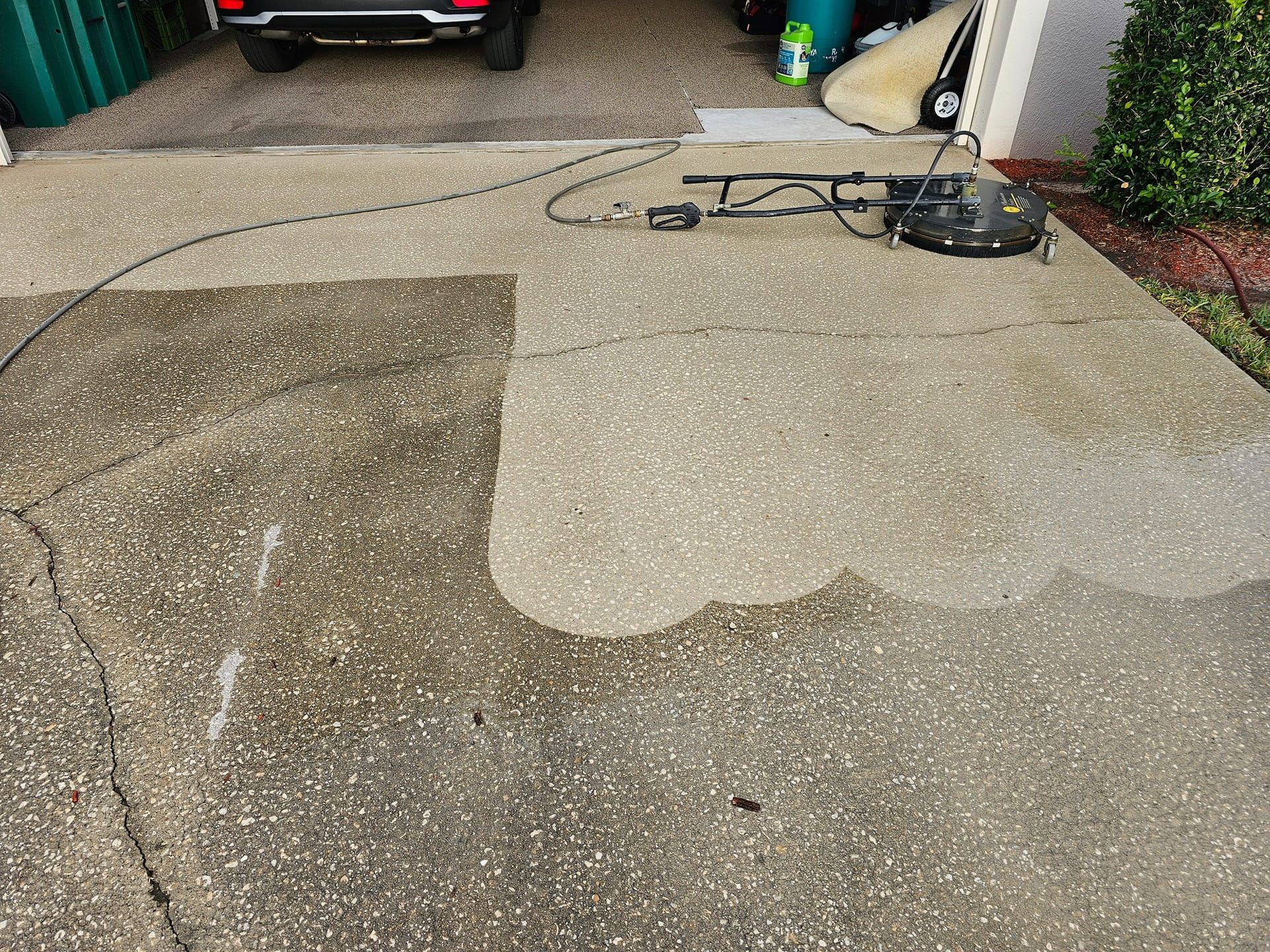 Woman in straw hat smiles, holding wine glass near a lake.