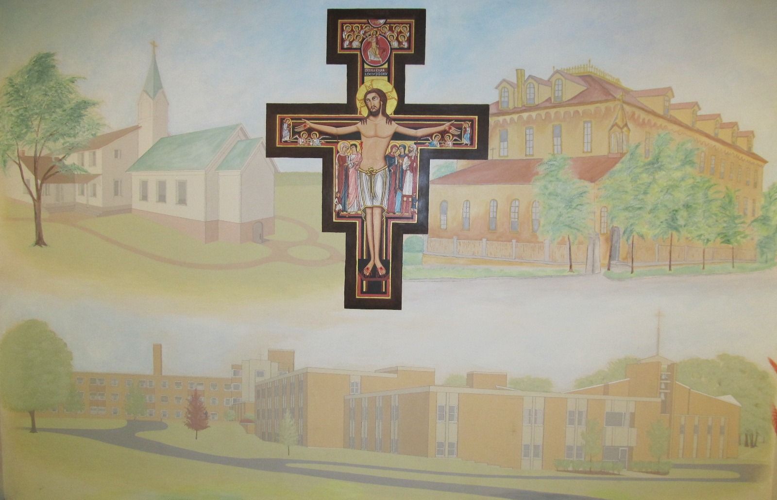 A crucifix mounted on a mural depicting three different church buildings set against a light background.