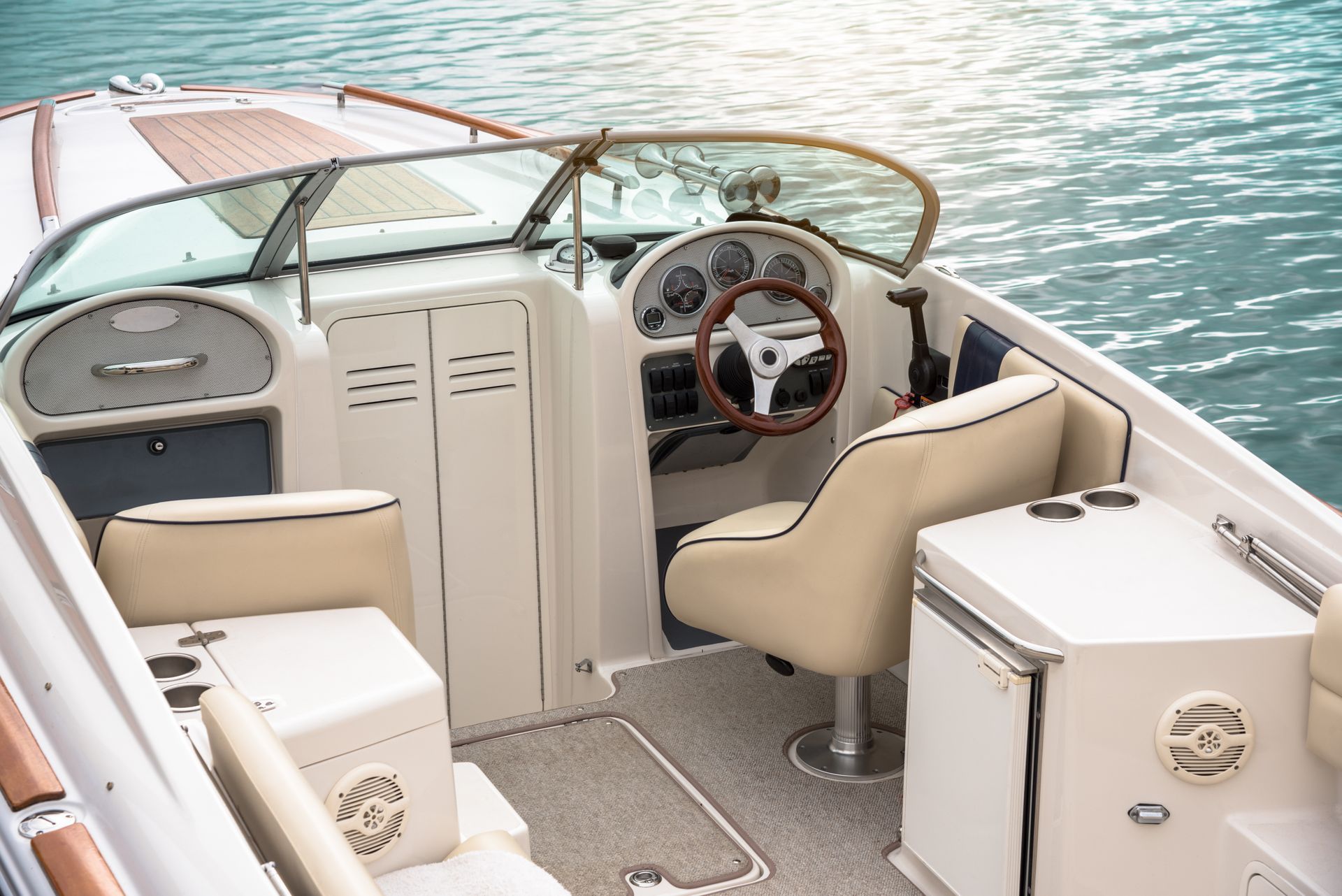 View of the empty cockpit of a moored speedboat on a sunny autumn day