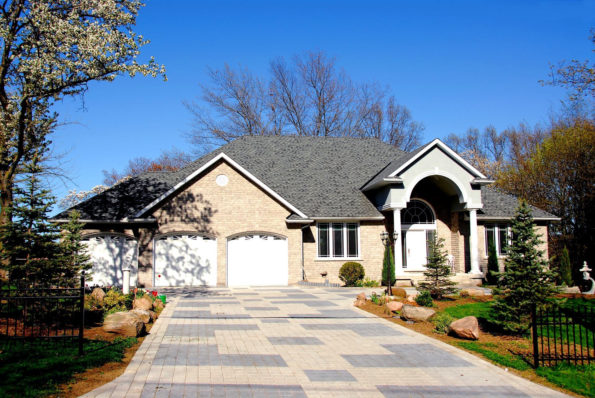 A large house with a driveway leading up to it