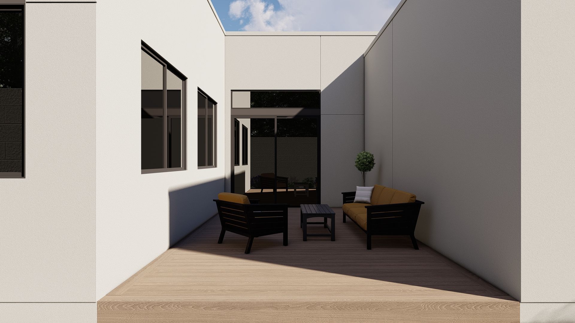 Outdoor patio with seating: dark furniture, small table, light walls, wooden floor, blue sky.