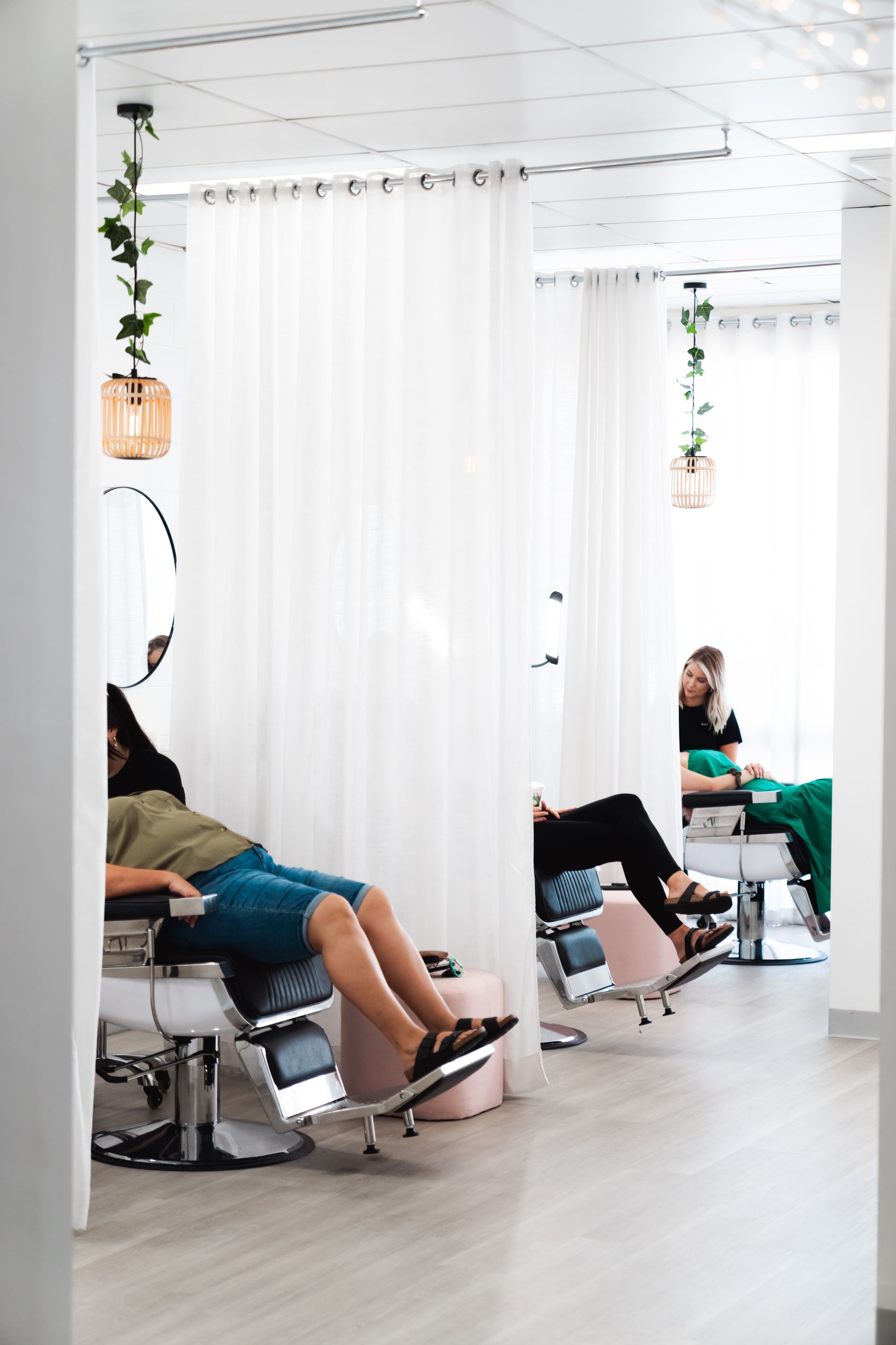 There Are Two Chairs And A Table In The Room — Bloom Skin Brows & Beauty In Bungalow, QLD