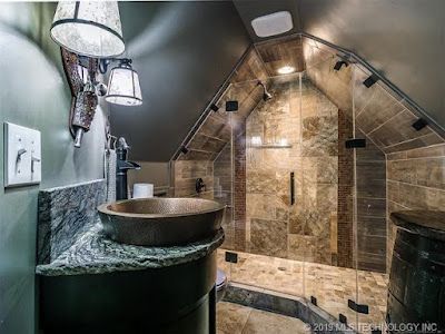 A bathroom with a sink and a walk in shower.