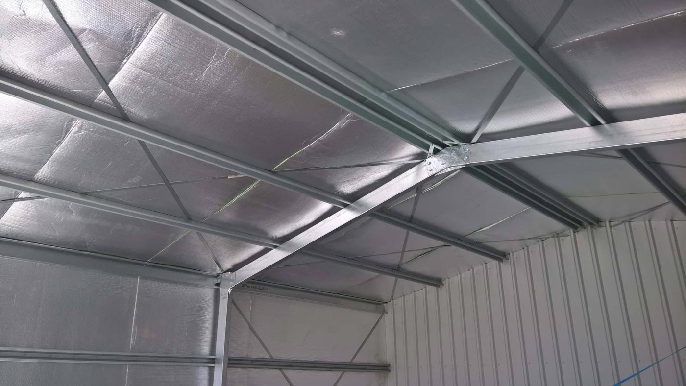 A Ceiling Fan Is Hanging From The Ceiling Of A Building — Alice Sheds & Structures In Ciccone, NT