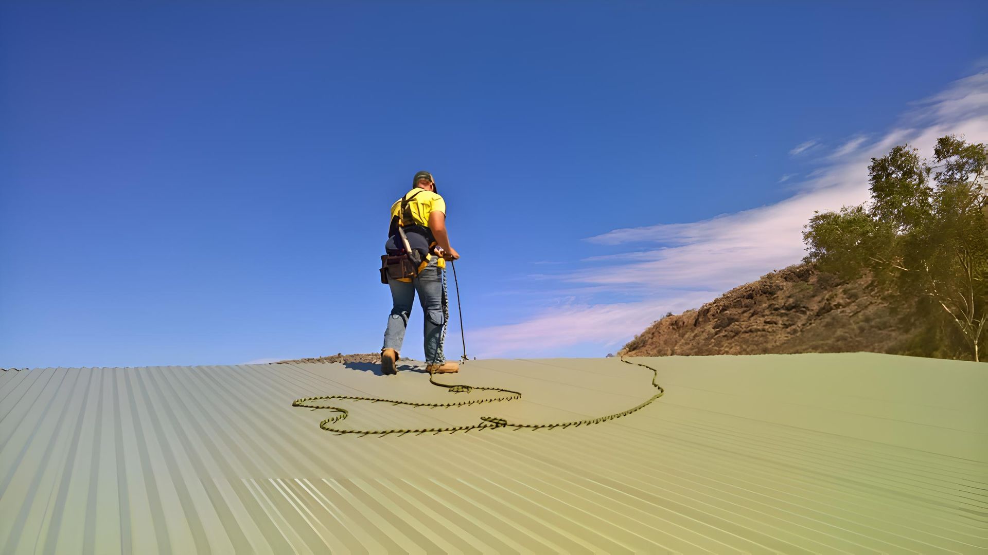 A Man Is Standing On Top Of A Sand Dune — Alice Sheds & Structures In Ciccone, NT