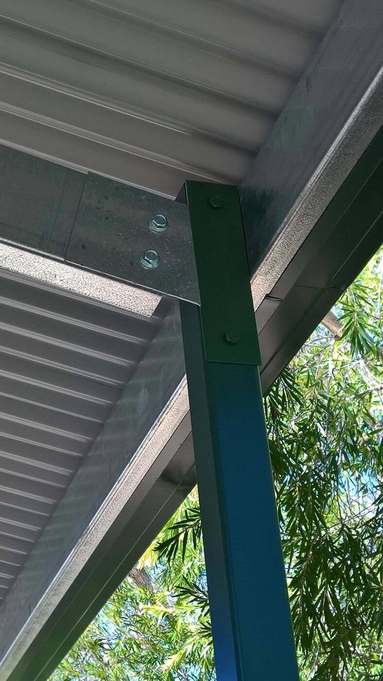 A Close Up Of A Roof With A Blue Pole Underneath It — Alice Sheds & Structures In Ciccone, NT