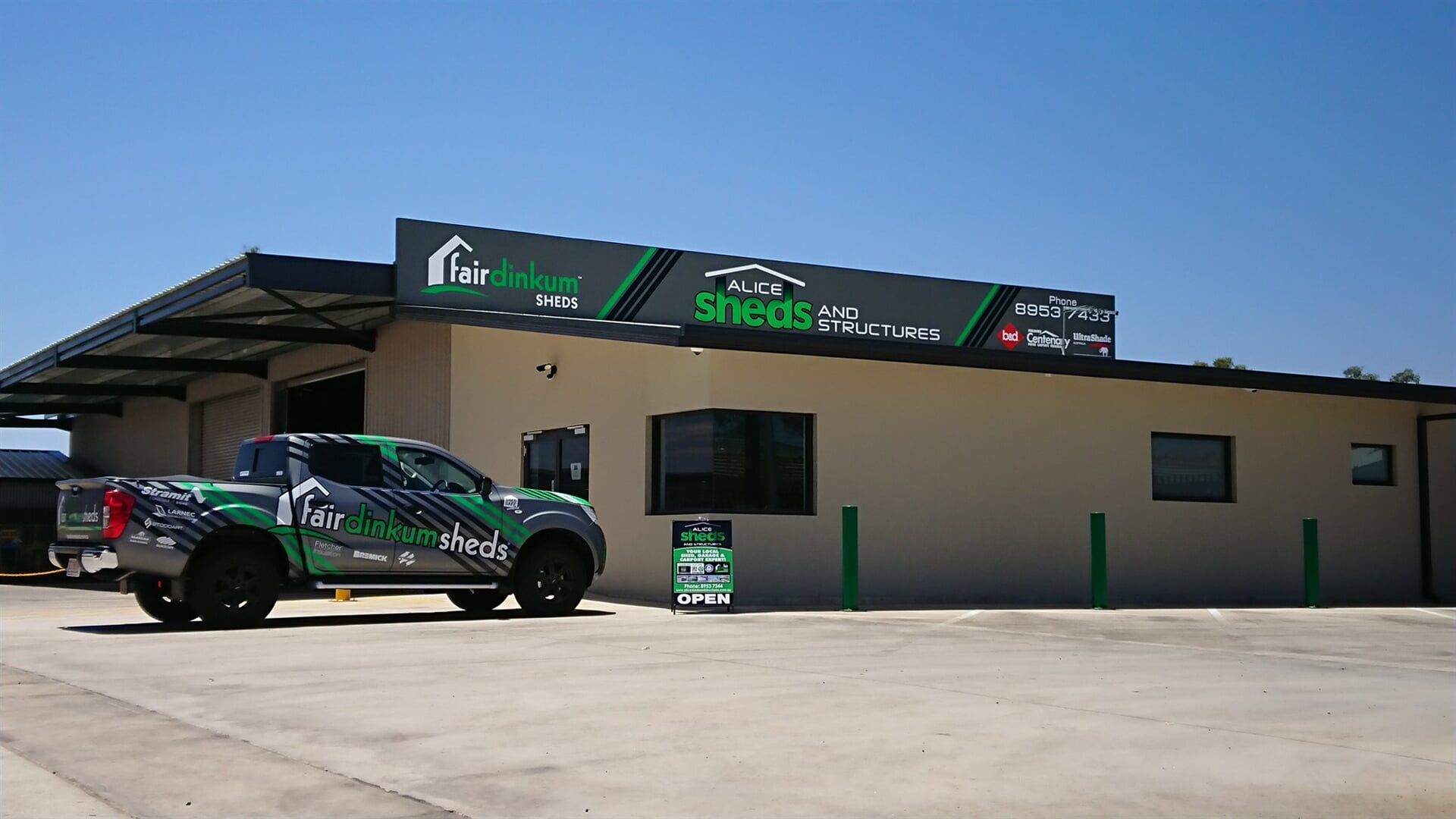 A Truck Is Parked In Front Of A Building — Alice Sheds & Structures In Ciccone, NT