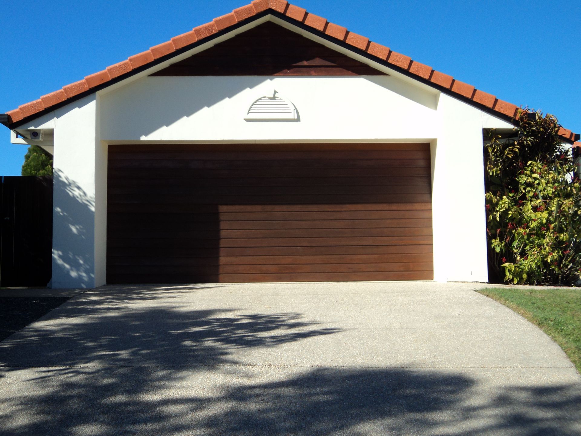 A White House With The Number 17 On The Front Of It — Coastal Auto Doors & Gates In Palmwoods, QLD
