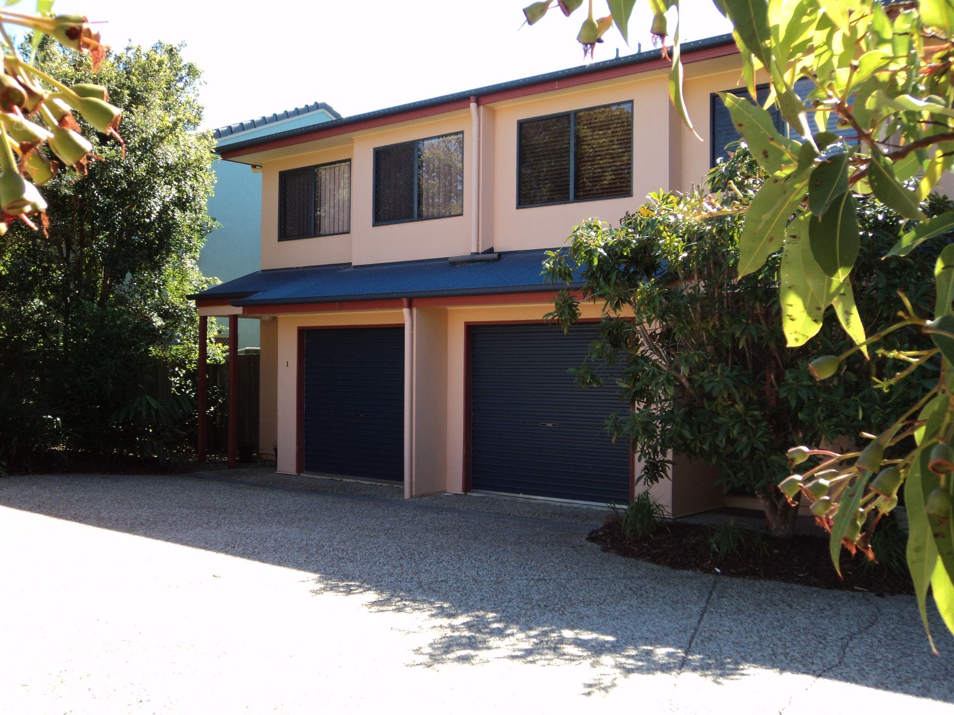 Two-story House With Two Garage Doors — Coastal Auto Doors & Gates In Palmwoods, QLD