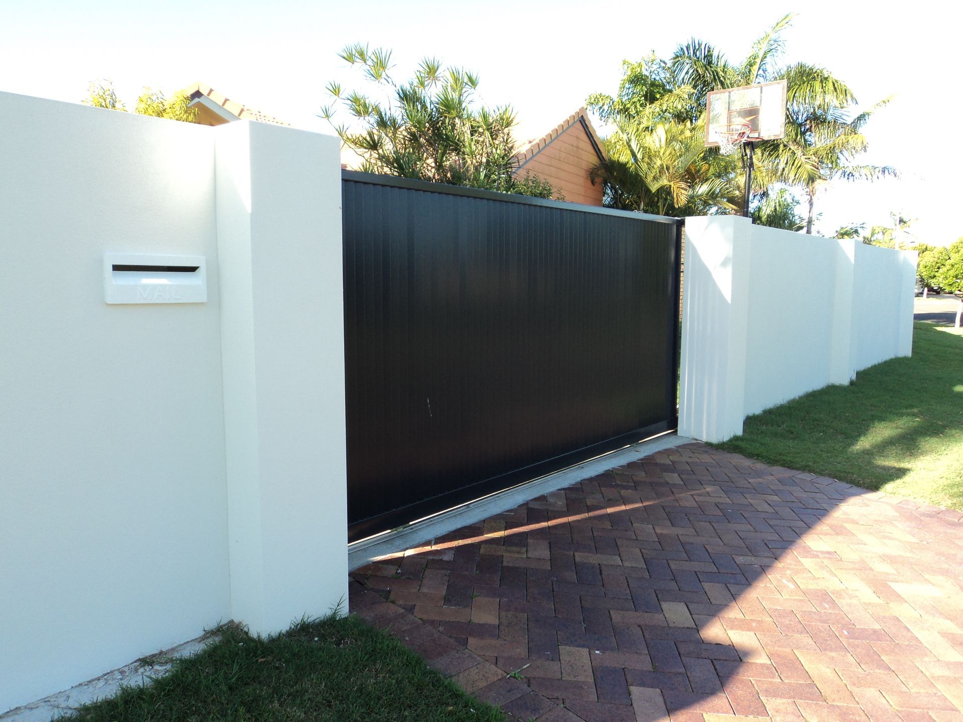 A White House With A White Garage Door — Coastal Auto Doors & Gates In Maroochydore, QLD