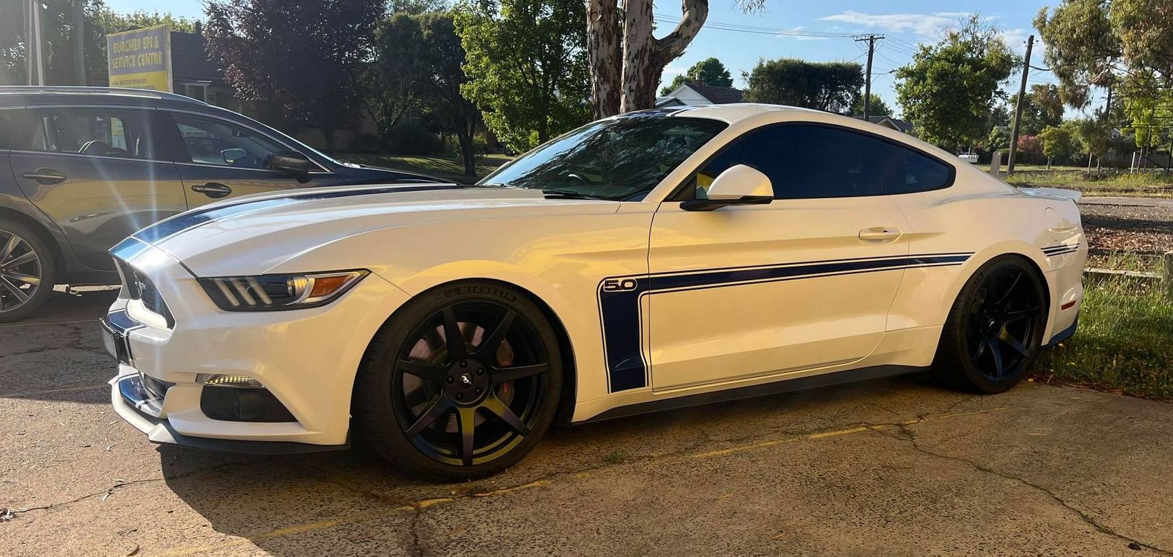 White Ford Mustang With Black Wheels and Racing Stripes — Burcher EFI & Service Centre in Orange, NSW