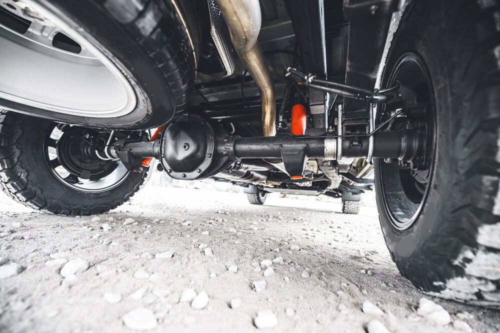 Underside View of a Black Off-road Vehicle's Rear Axle and Suspension — Burcher EFI & Service Centre in Orange, NSW