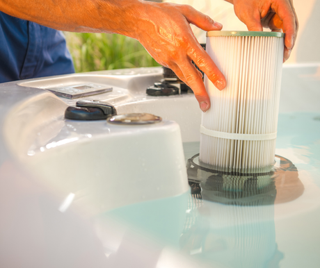 Service tech changing filter on hot tub