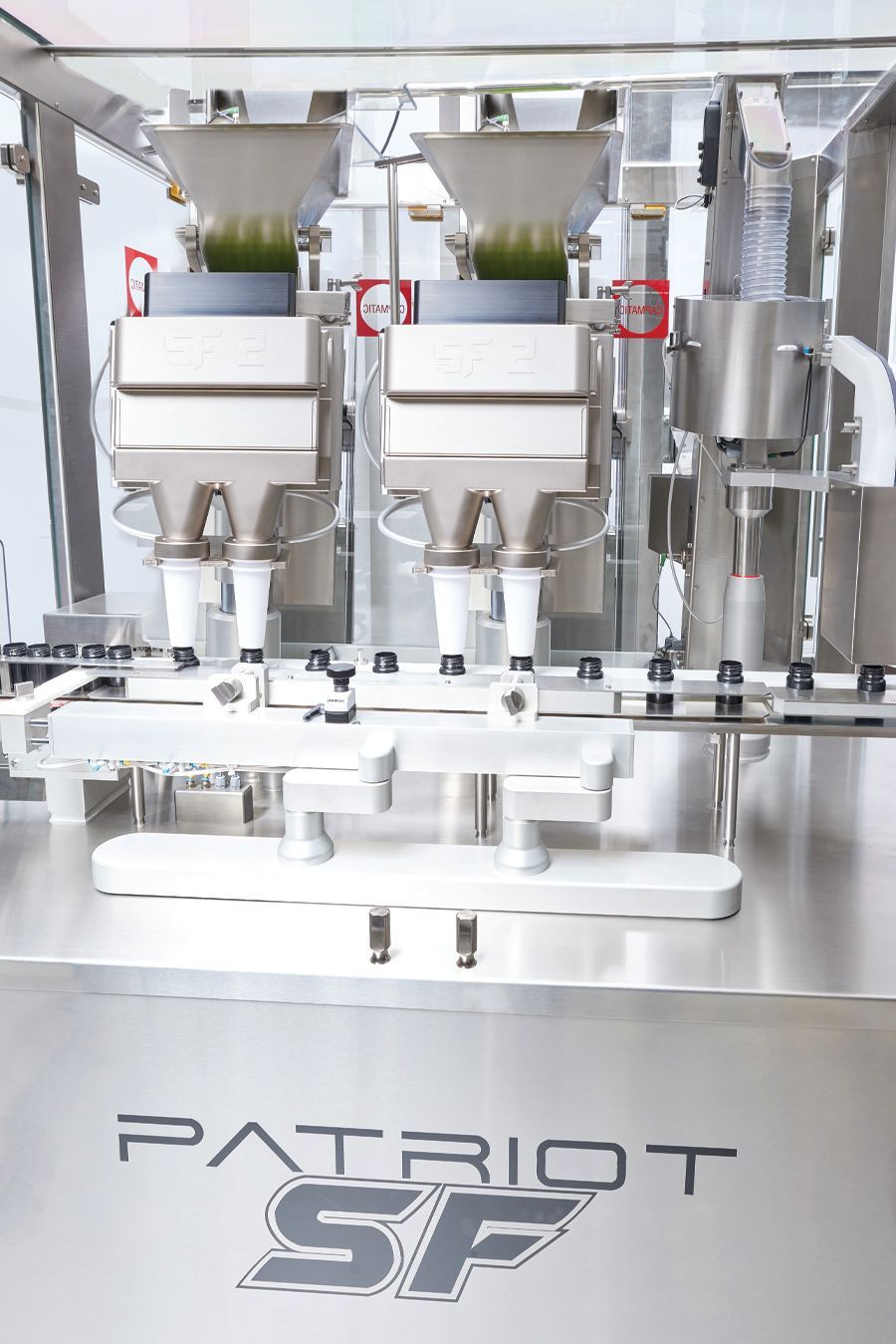 A patriot sf machine is sitting on a counter in a factory.