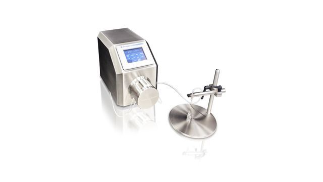 A machine is sitting on top of a metal stand on a white surface.