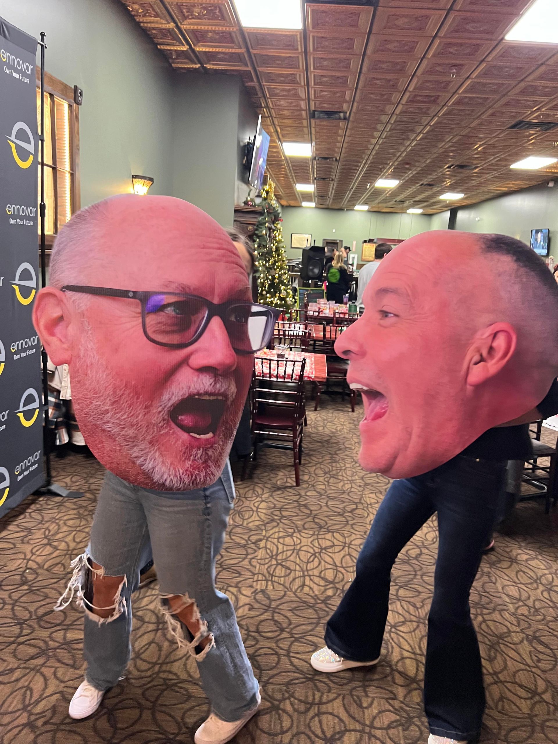 Guests party with Big Head Cutouts at The Brass Taproom