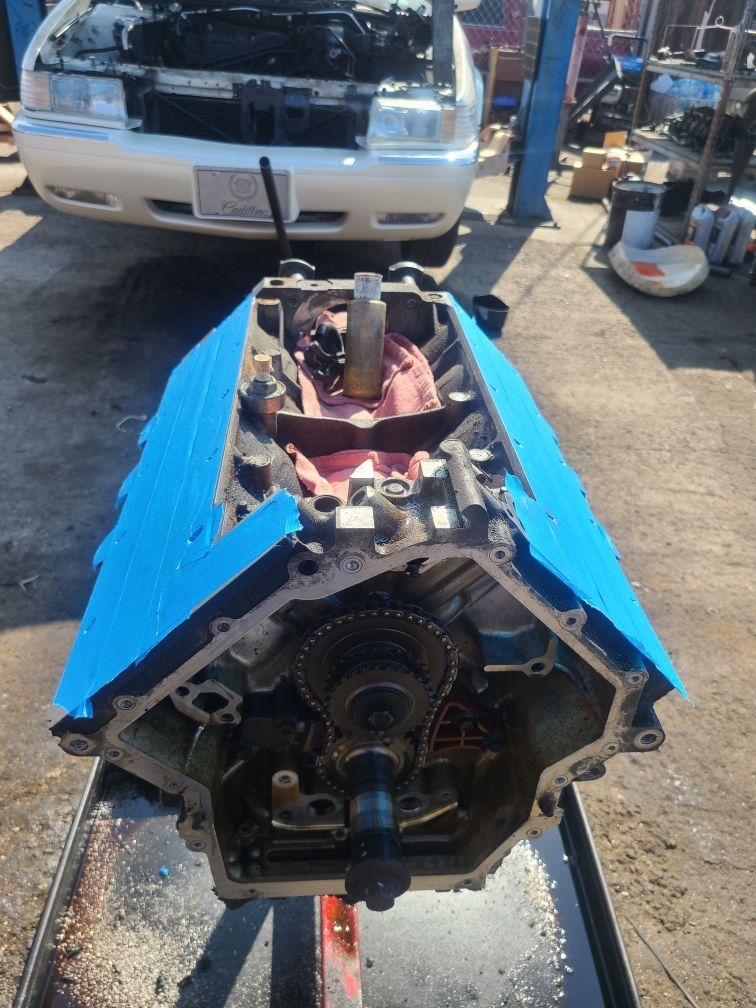 A car engine is being worked on in a garage