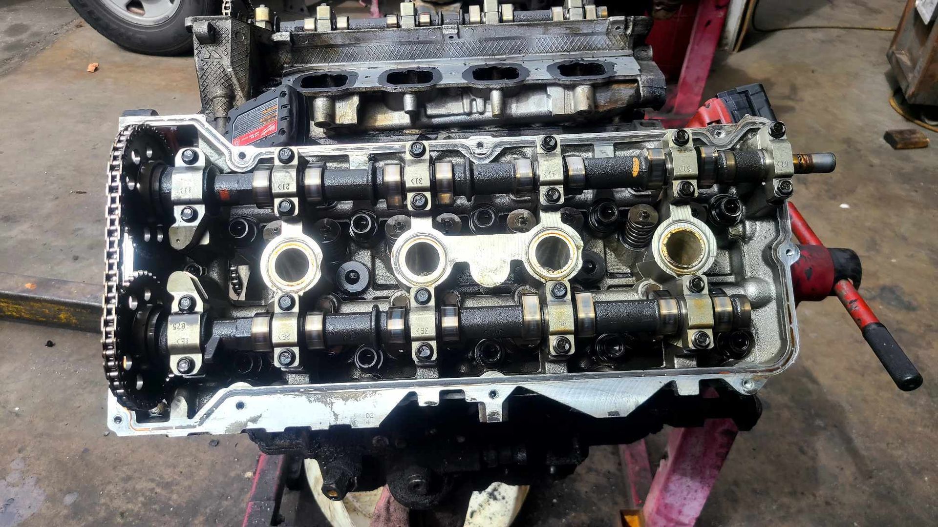 A car engine is being worked on in a garage