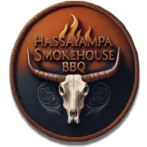Hassayampa Smokehouse BBQ logo with a longhorn skull, rope border, and flames on a brown circular badge