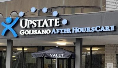 Sign for Upstate Golisano After Hours Care with valet service entrance below.