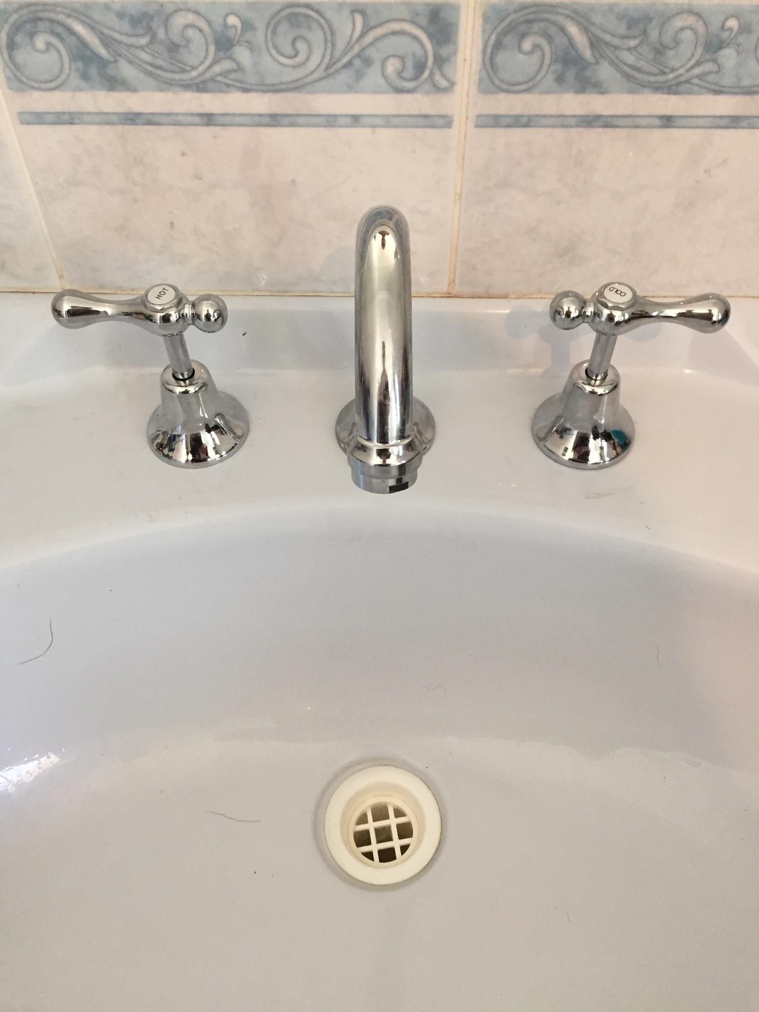 Bathroom Sink With Chrome Faucet and Handles, White Porcelain Basin — Hunter Plumbing And Hotwater in Lemon Tree Passage, NSW