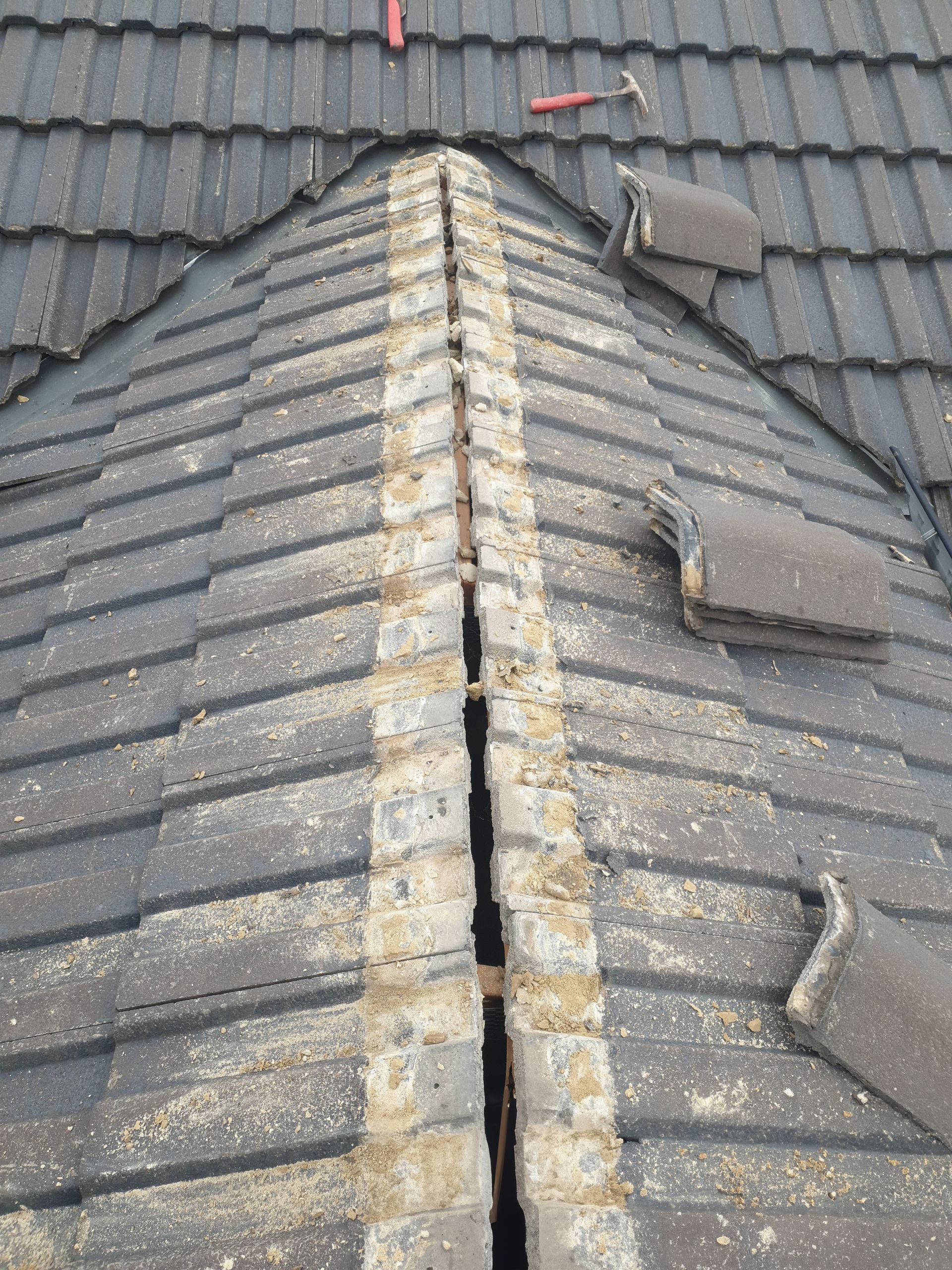 Construction worker is working on a metal roof— Qualified Roofer in Canberra