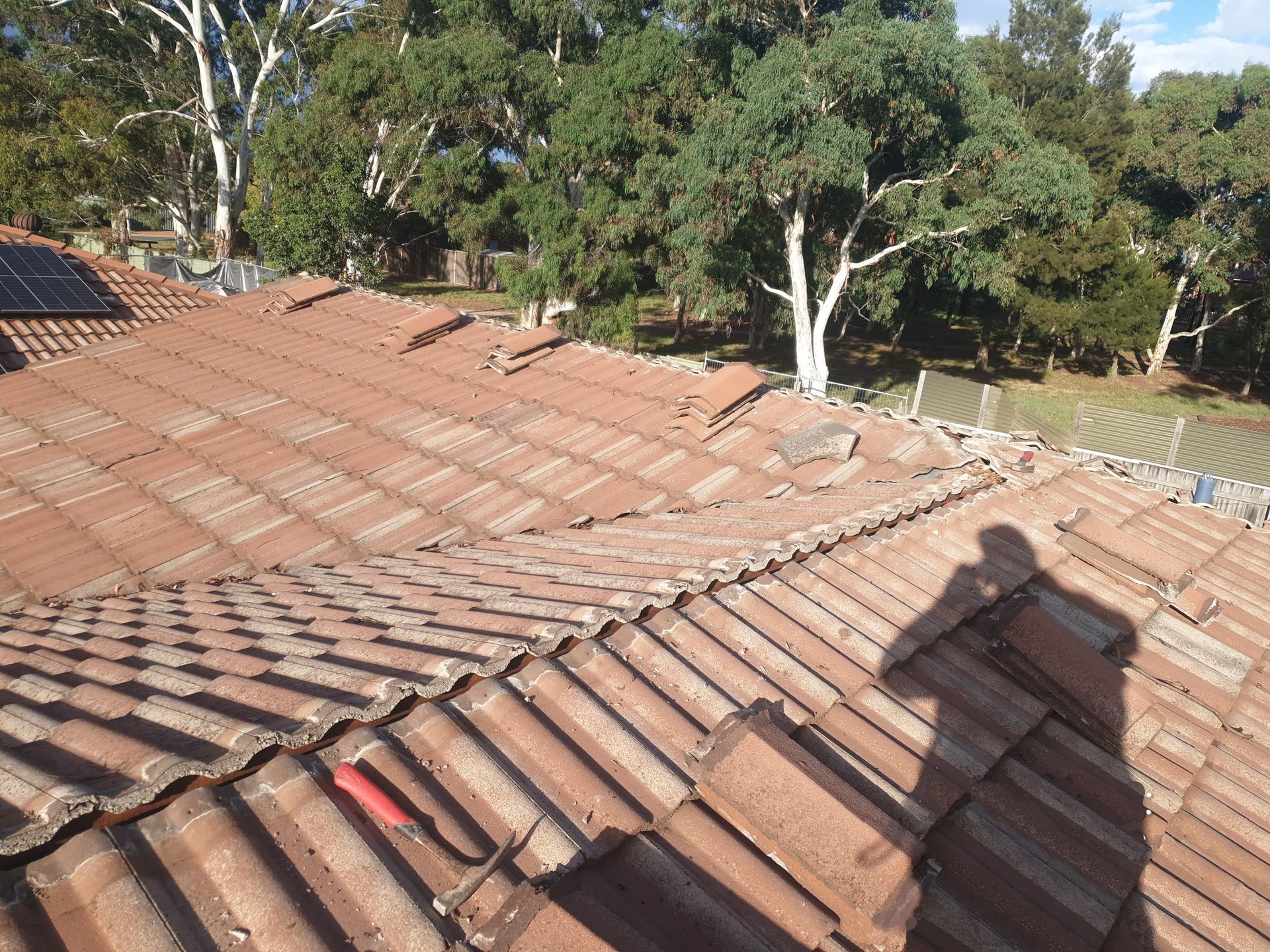 Close view of a black roof ridge capping — Licensed Roofer in Bungendore