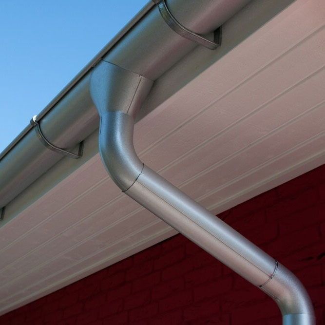 Silver roof downpipe — Licensed Roofer in Bungendore