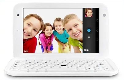 A laptop with a picture of a group of children on the screen.