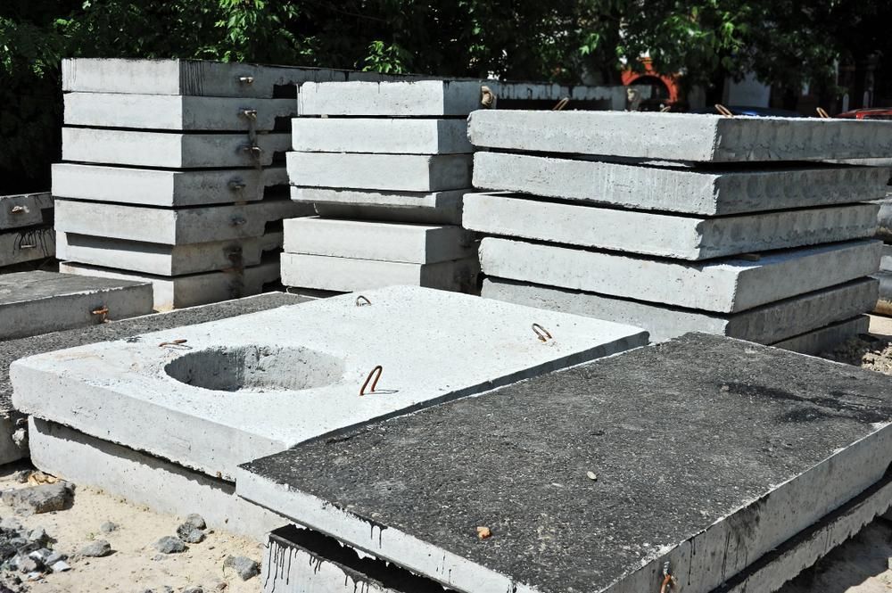 A Pile Of Concrete Slabs With A Hole In The Middle — Dubbo Mini Mix & Landscape Supplies In Dubbo, NSW
