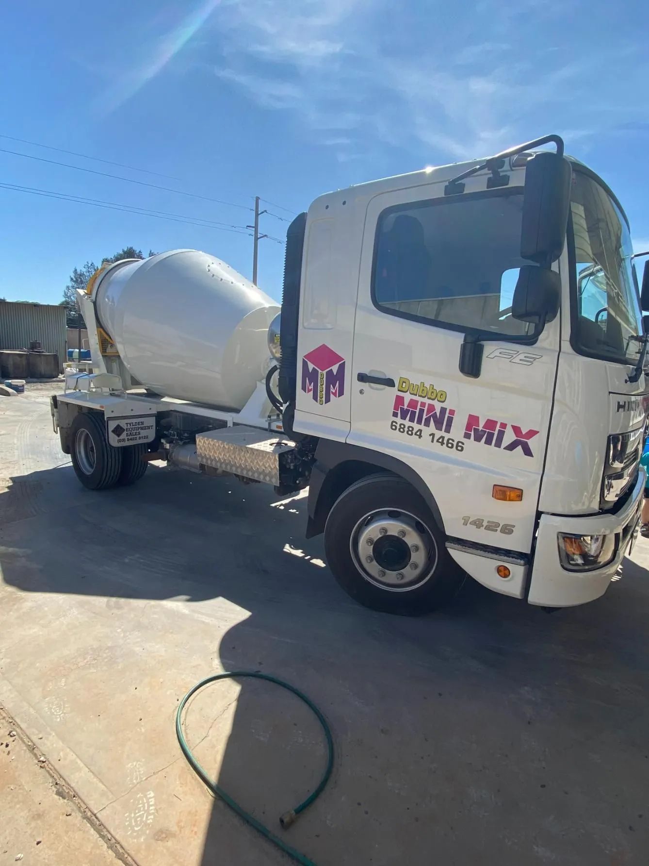 A white concrete mixer truck is parked in a parking lot — Dubbo Mini Mix & Landscape Supplies In Dubbo, NSW