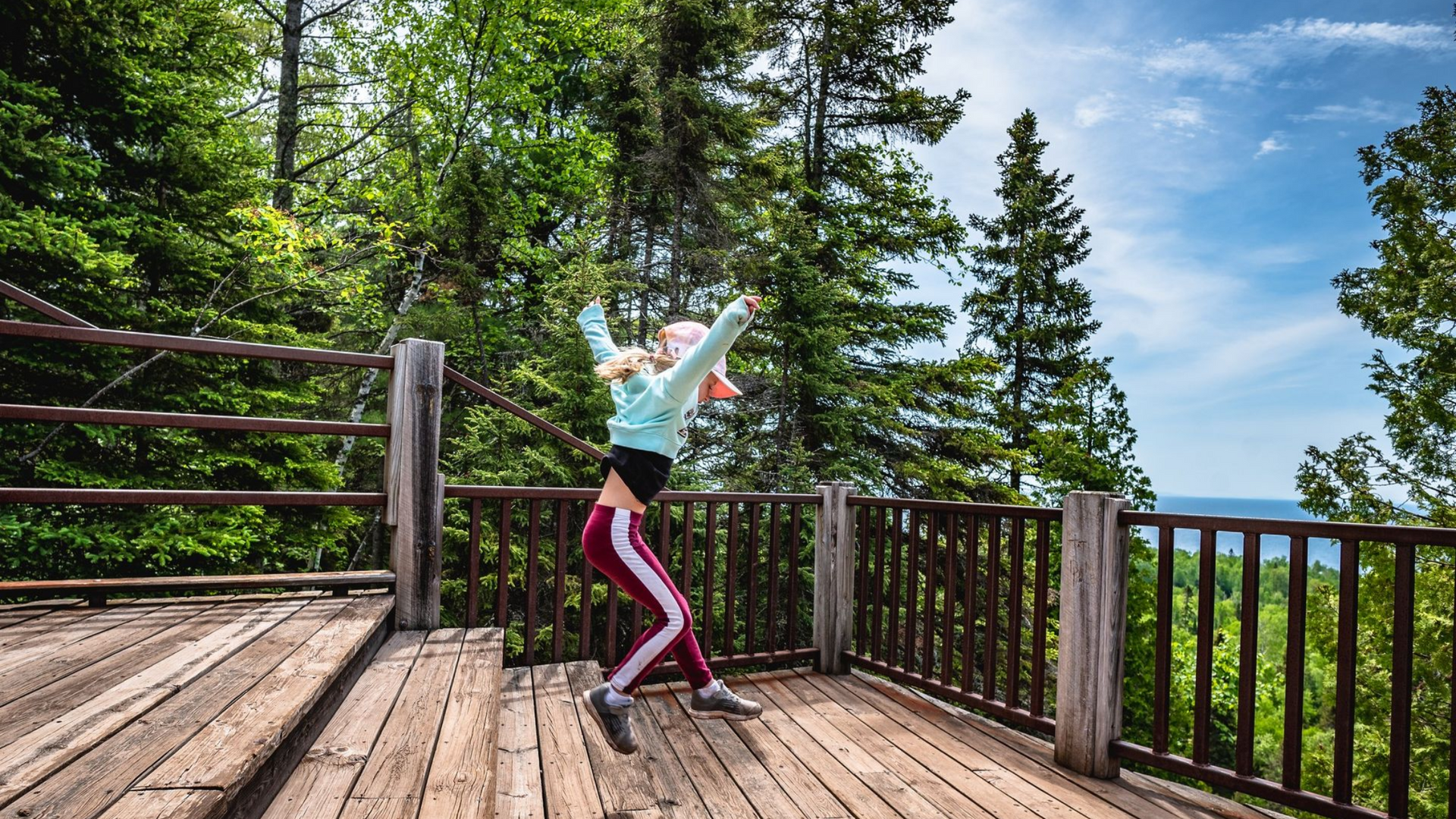 people holding a group of cocktails together