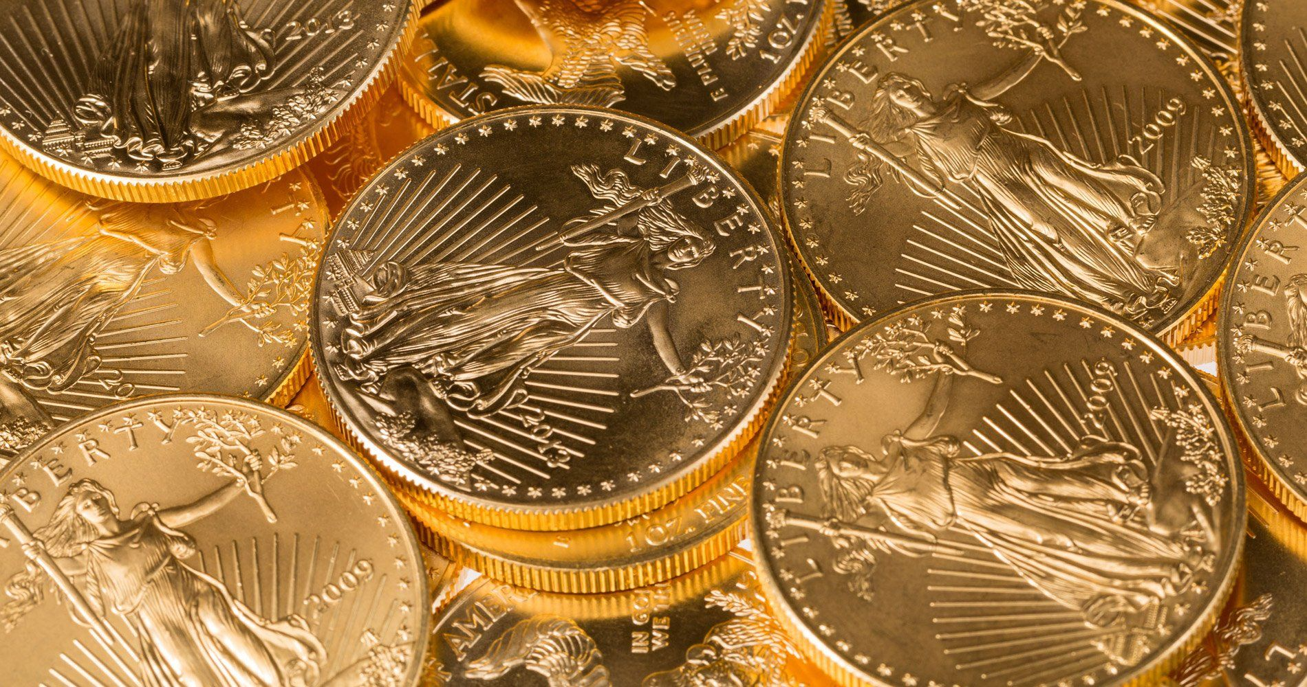 A pile of gold coins stacked on top of each other.